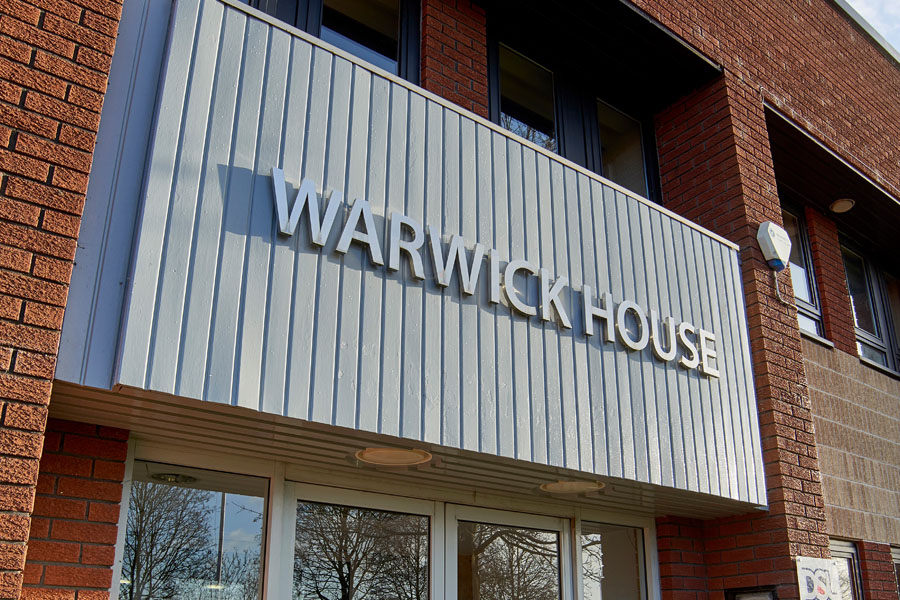 Front view and signage for Warwick House fronting industrial units Southam